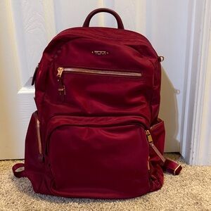 Tumi Burgundy Backpack with Gold Accents